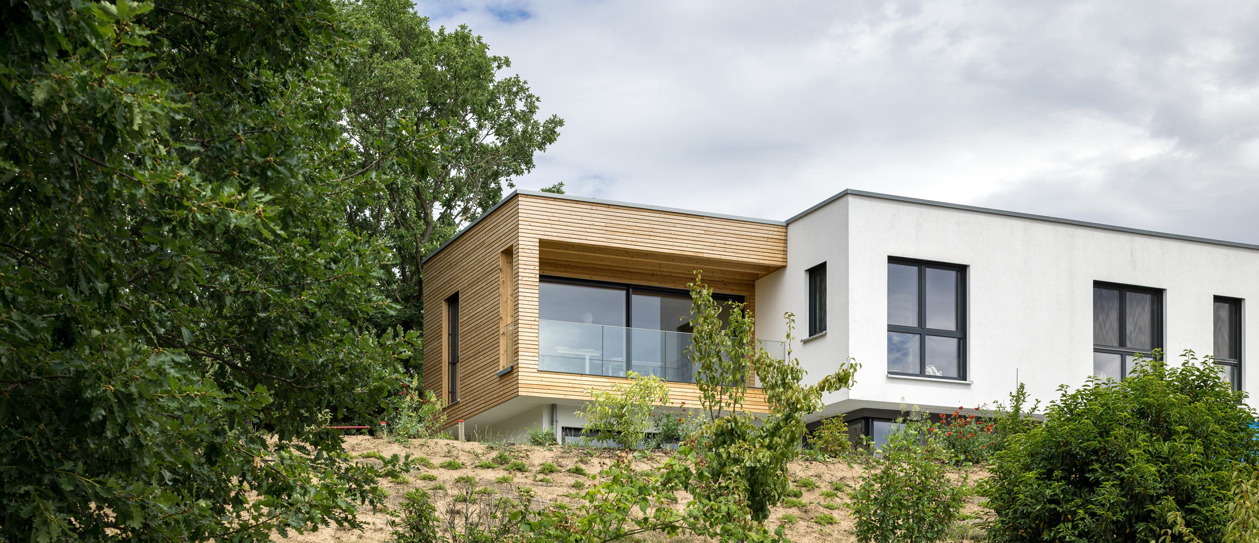 Hausanbau aus Holz an Bestandsgebäude